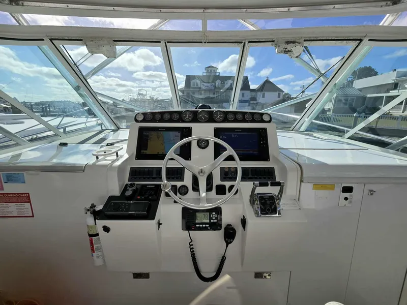 Slide: The Image of 2002 Rampage 38 Express helm with instruments and controls. - 25