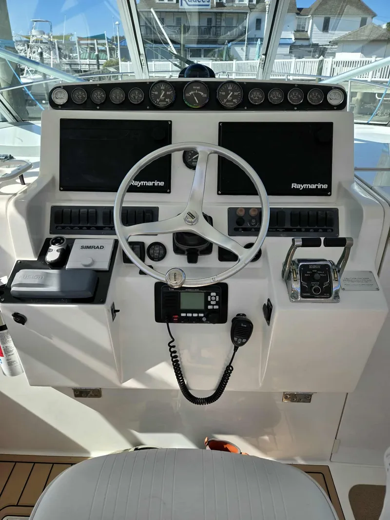 Slide: The Image of Rampage 38 Express 2002 helm with Raymarine equipment. - 26