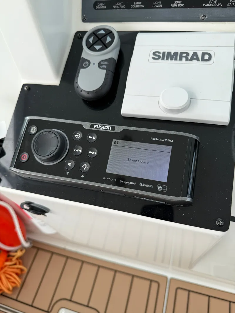 Slide: The Image of Fusion MS-UD750 and Simrad controls on 2002 Rampage 38 Express. - 28