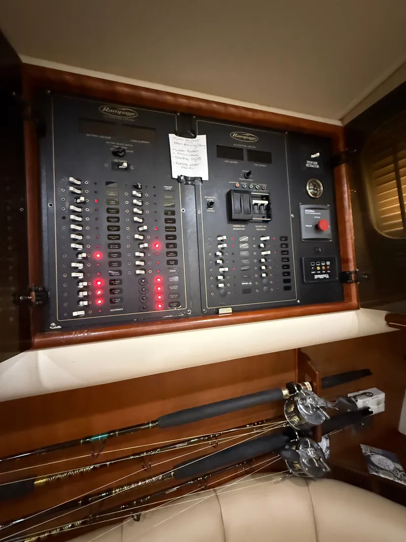 Slide: The Image of Electrical control panel on a 2002 Rampage 38 Express boat. - 33
