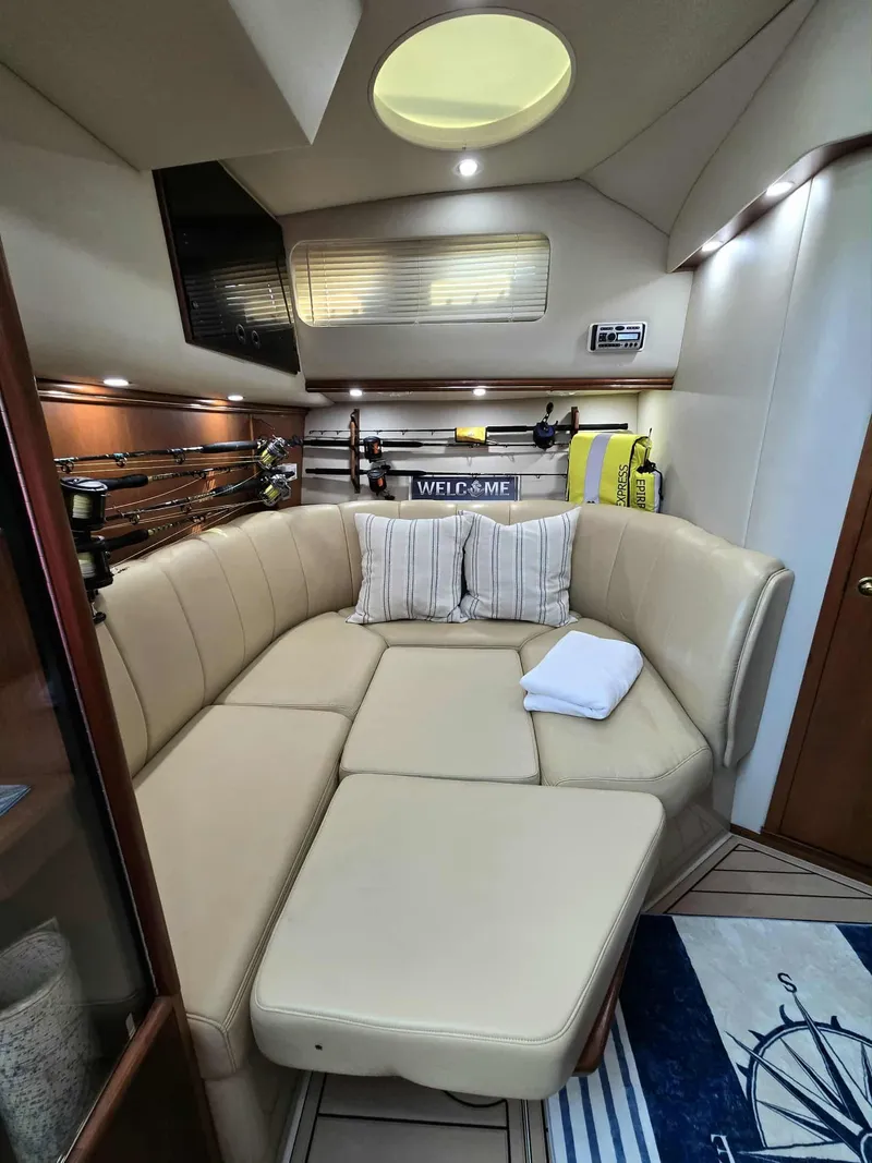 Slide: The Image of Interior of a 2002 Rampage 38 Express yacht with beige sofa. - 35