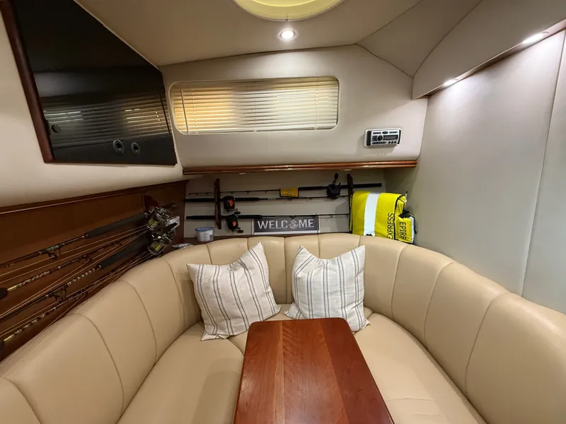 Slide: The Image of Interior of a 2002 Rampage 38 Express yacht with cozy seating area. - 36