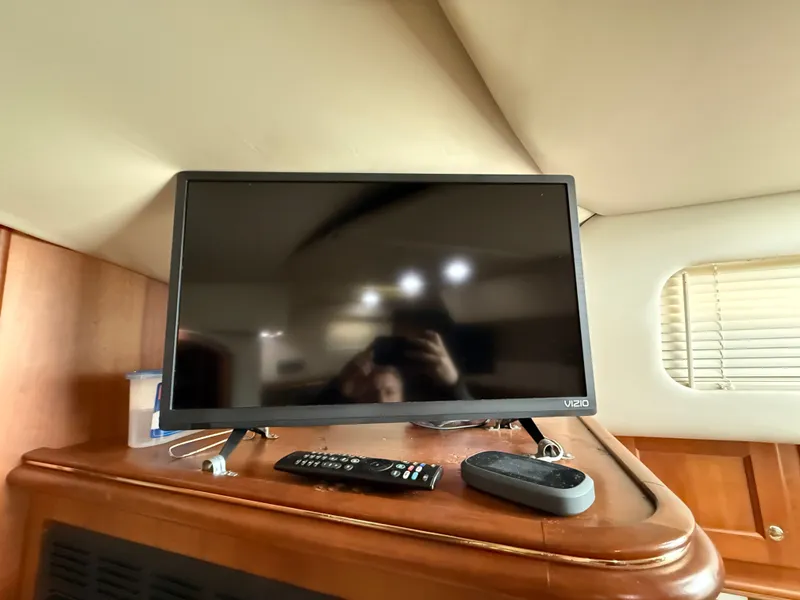 Slide: The Image of TV and remote on Rampage 38 Express yacht, year 2002. - 40
