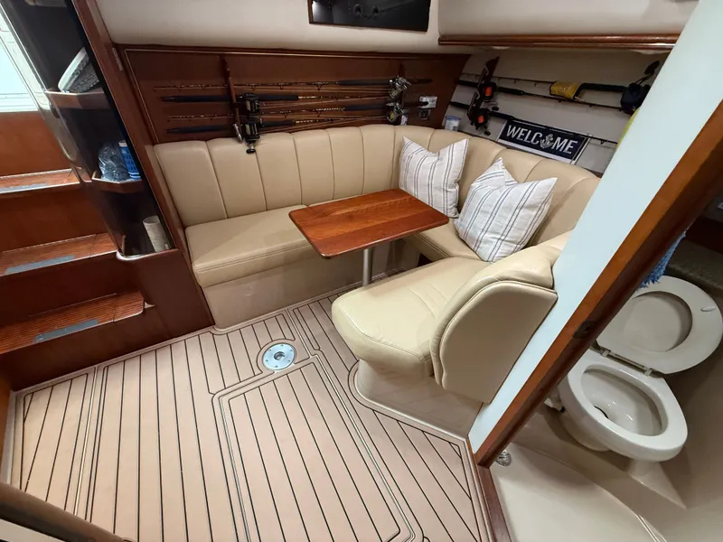 Slide: The Image of Interior of a 2002 Rampage 38 Express yacht with seating area. - 41