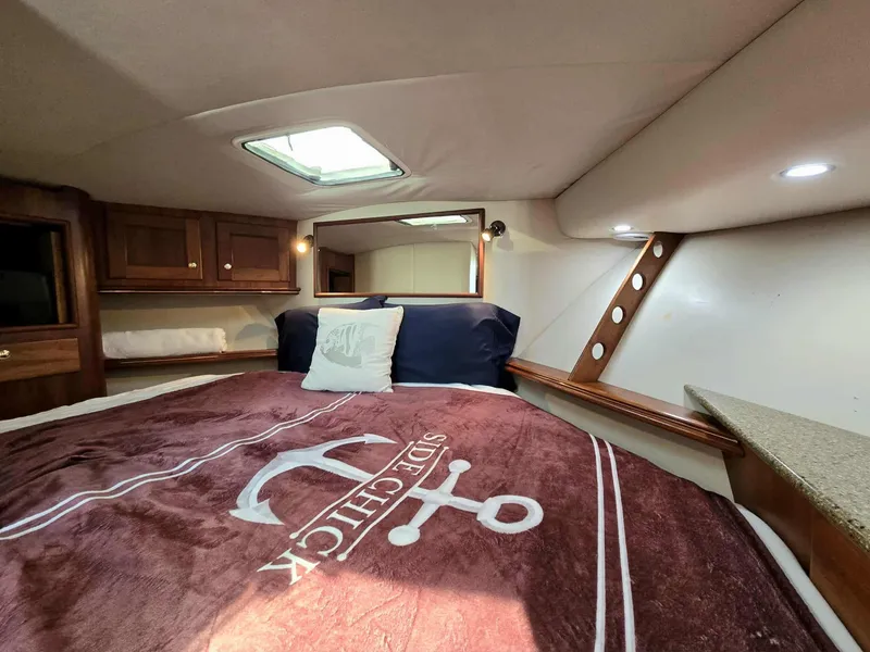 Slide: The Image of Interior of 2002 Rampage 38 Express with cozy bed and skylights. - 48