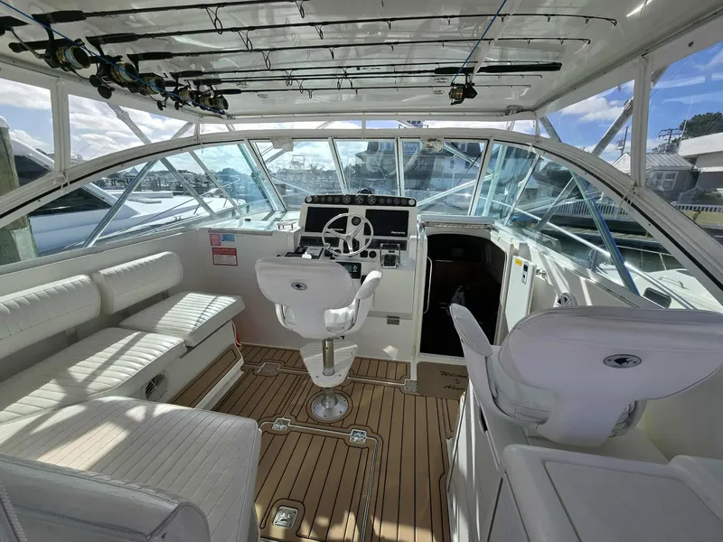 Slide: The Image of Interior view of a 2002 Rampage 38 Express boat with helm station. - 6