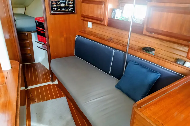 Slide: The Image of Interior of 1994 Hunter Legend 40 sailboat with wooden finish and cozy seating area. - 15