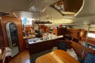 Slide: The Image of Interior of a 1994 Hunter Legend 40 yacht with wood finishes and modern amenities. - 21