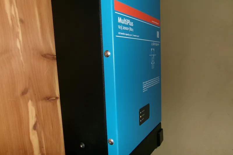 Slide: The Image of Blue MultiPlus inverter mounted on wooden panel, Hunter Legend 40, 1994 model. - 23