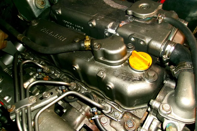 Slide: The Image of Engine of a 1994 Hunter Legend 40 sailboat, featuring detailed components and hoses. - 24