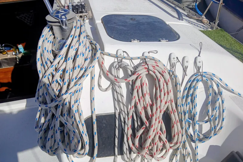Slide: The Image of Deck of 1994 Hunter Legend 40 sailboat with neatly coiled ropes and winch. - 3
