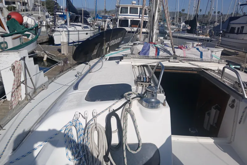 Slide: The Image of Hunter Legend 40 sailboat, 1994 model, docked at marina with ropes and equipment. - 4