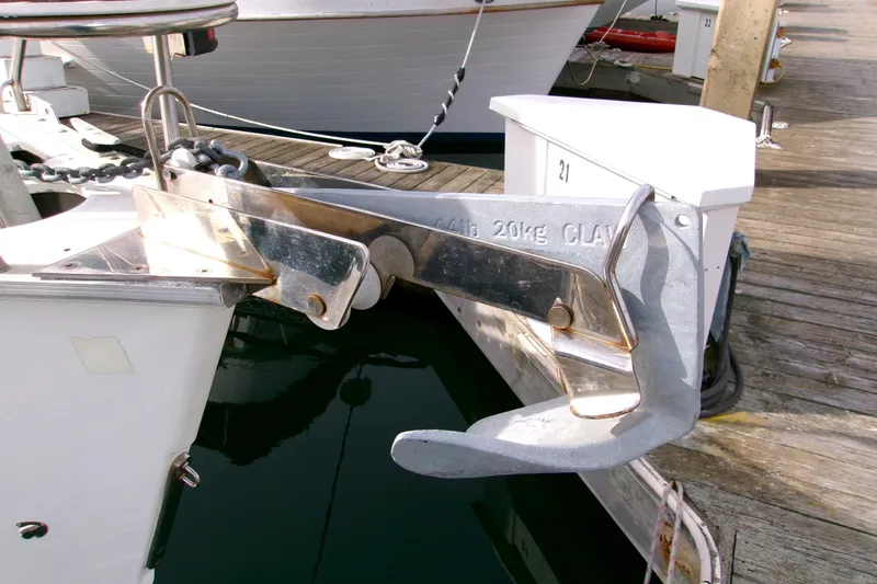 Slide: The Image of Anchor on a 1994 Hunter Legend 40 yacht, docked at a marina. - 7