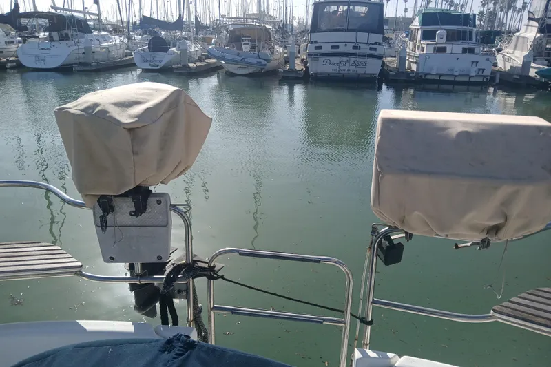 Slide: The Image of Hunter Legend 40 sailboat, 1994 model, docked in a marina with covered equipment. - 8