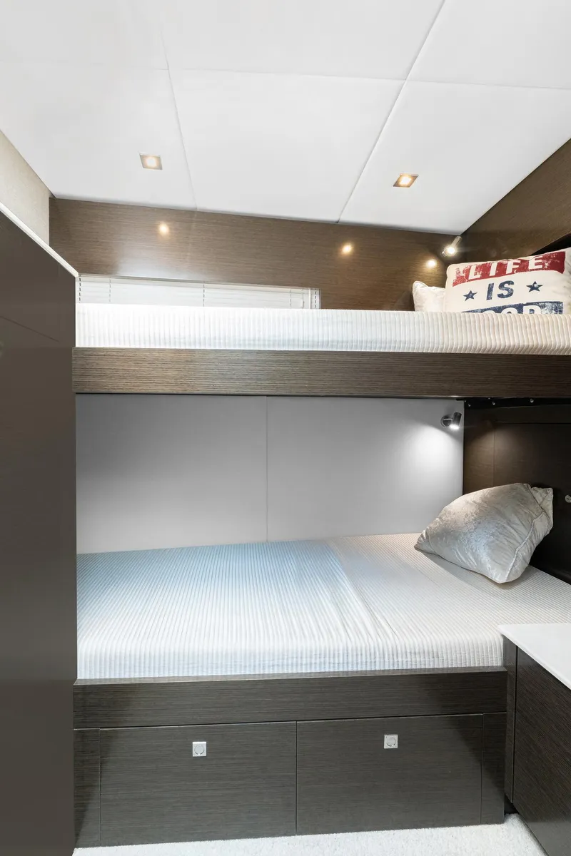 Slide: The Image of 2018 Cruisers Yachts 50 Cantius interior with modern bunk beds and sleek design. - 16