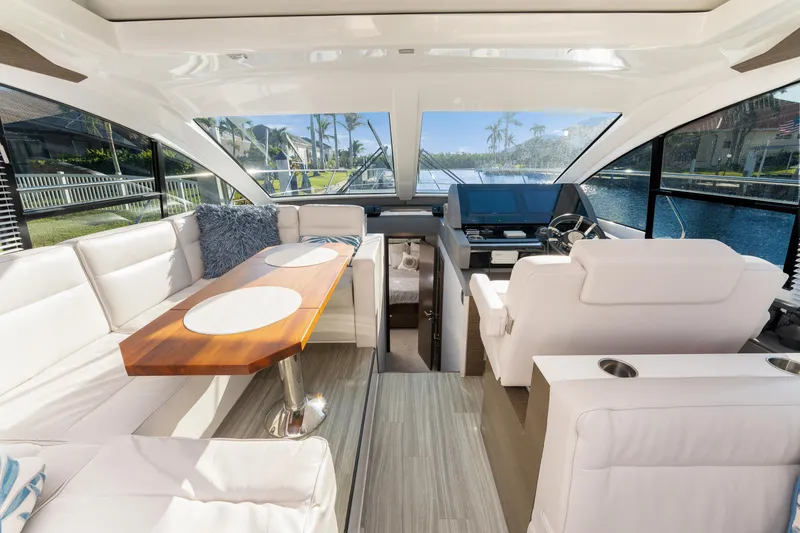 Slide: The Image of Luxurious interior of 2018 Cruisers Yachts 50 Cantius with elegant seating and helm. - 31