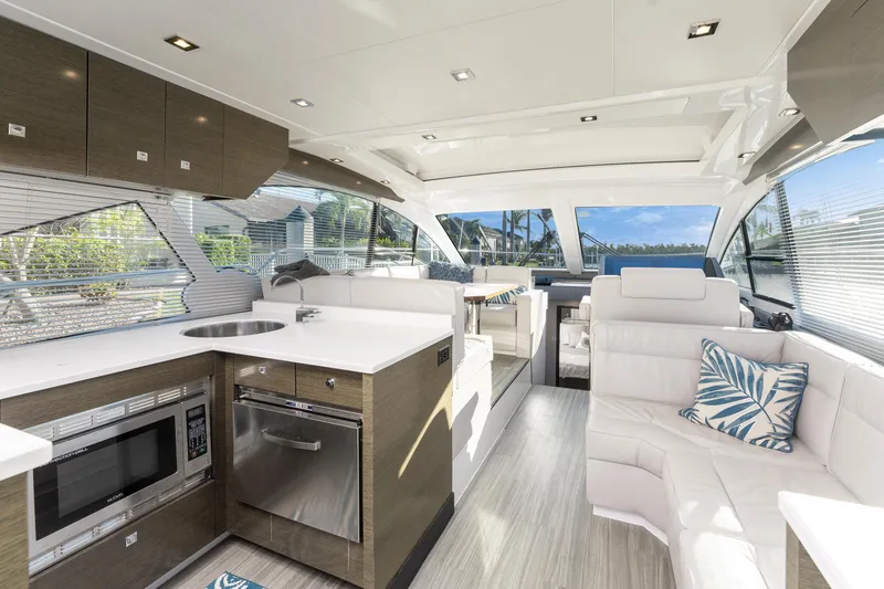 Slide: The Image of Luxurious interior of 2018 Cruisers Yachts 50 Cantius with modern kitchen and seating area. - 33