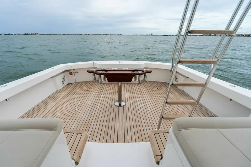 Slide: The Image of 2021 Viking 46 Billfish yacht deck with ladder and ocean view. - 15
