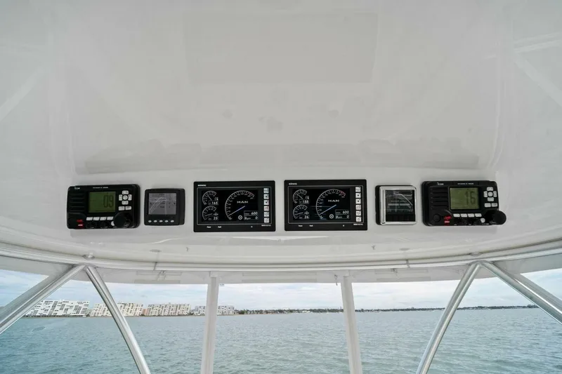Slide: The Image of 2021 Viking 46 Billfish dashboard with navigation and control instruments. - 28