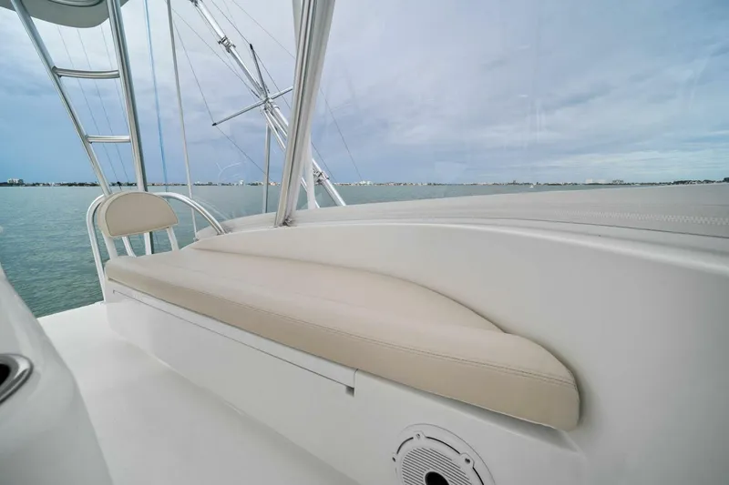 Slide: The Image of 2021 Viking 46 Billfish boat interior with beige seating and ocean view. - 34