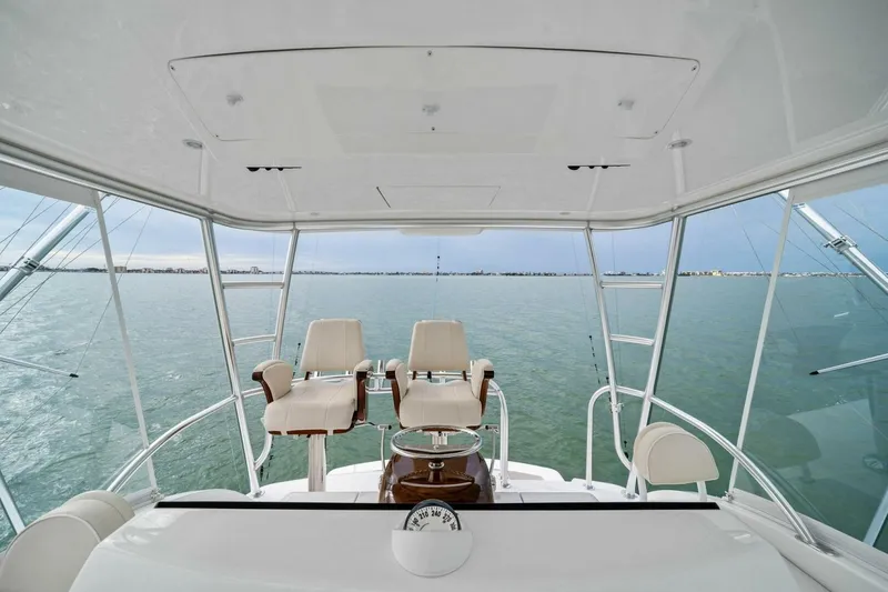 Slide: The Image of Flybridge view of 2021 Viking 46 Billfish yacht with ocean backdrop. - 36