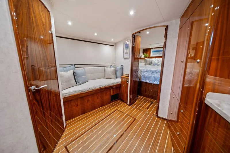 Slide: The Image of Luxurious interior of 2021 Viking 46 Billfish yacht with elegant wood finish and cozy seating. - 59