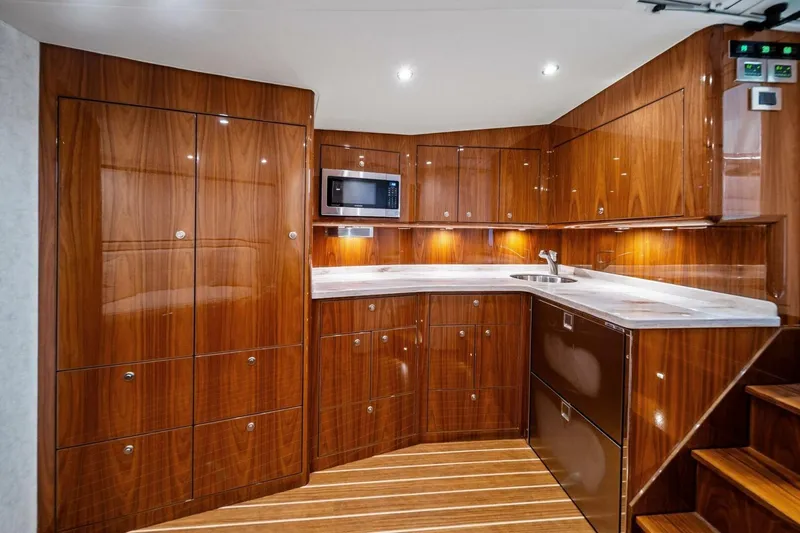 Slide: The Image of Luxurious wood-finished kitchen interior of 2021 Viking 46 Billfish yacht. - 61