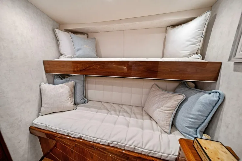 Slide: The Image of Cozy bunk beds with plush pillows in 2021 Viking 46 Billfish yacht cabin. - 65