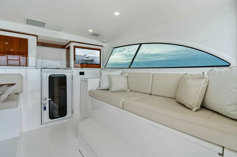 Slide: The Image of Interior of 2021 Viking 46 Billfish yacht with plush seating and modern design. - 7