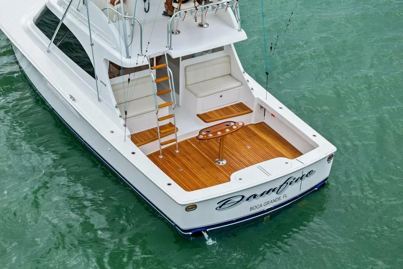 Slide: The Image of 2021 Viking 46 Billfish yacht with teak deck in turquoise water. - 75