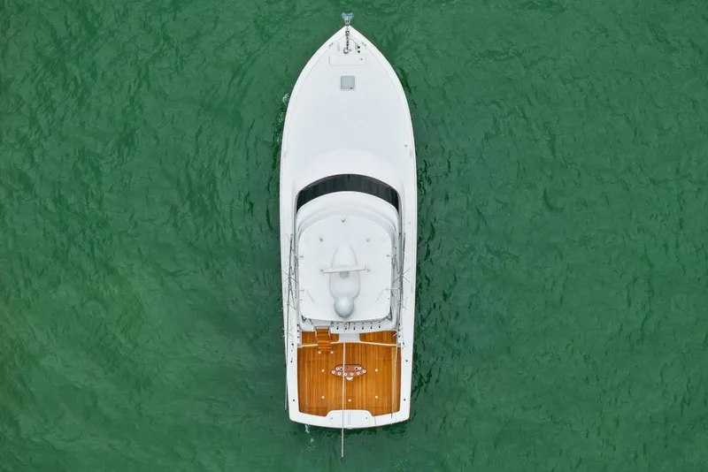 Slide: The Image of Aerial view of 2021 Viking 46 Billfish yacht on green water. - 77