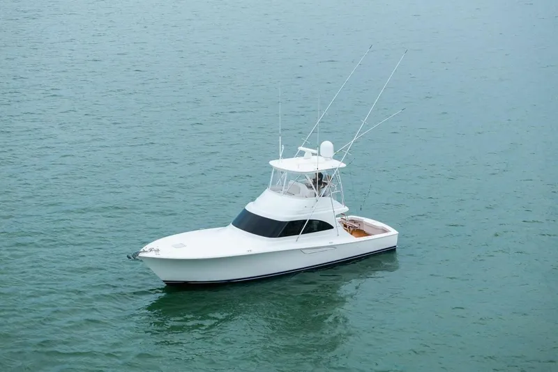 Slide: The Image of 2021 Viking 46 Billfish yacht on calm water, showcasing sleek design and fishing capabilities. - 89