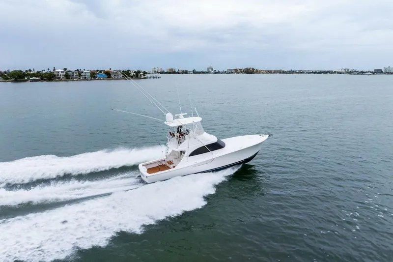 Slide: The Image of 2021 Viking 46 Billfish yacht cruising on open water, aerial view. - 93