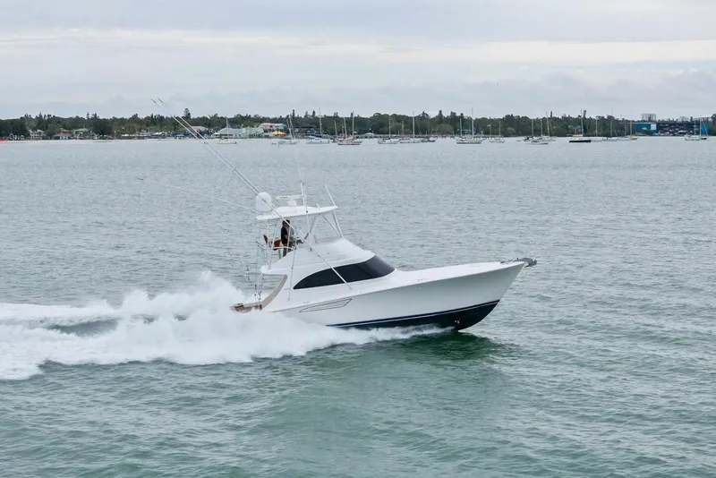 Slide: The Image of 2021 Viking 46 Billfish yacht cruising on open water, showcasing sleek design and performance. - 95