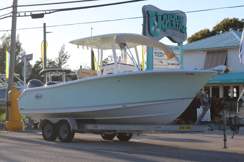 Slide: The Image of 2016 Sea Hunt Gamefish 25 boat on trailer at Unique Marine dealership. - 2