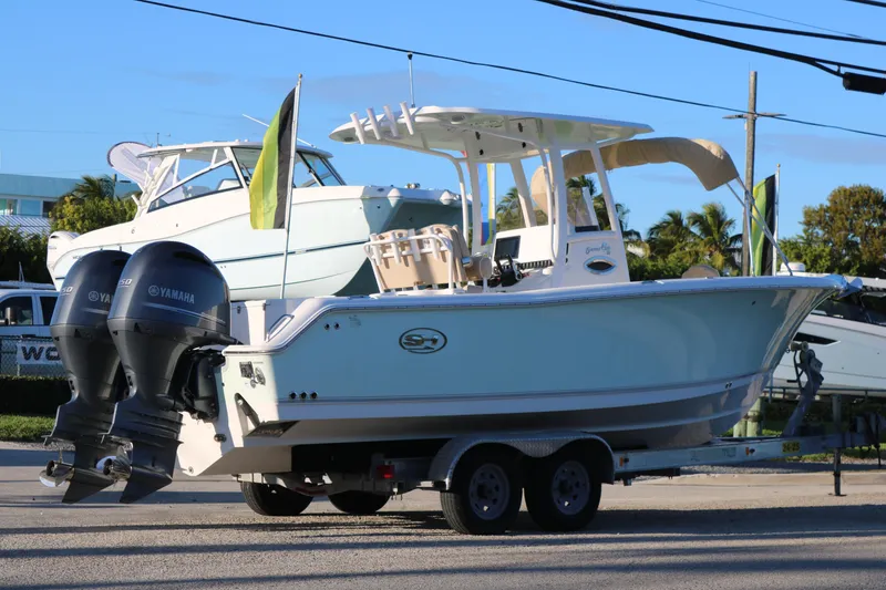 Slide: The Image of 2016 Sea Hunt Gamefish 25 boat on trailer with twin Yamaha engines. - 3