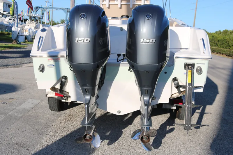 Slide: The Image of 2016 Sea Hunt Gamefish 25 with dual Yamaha 150 outboard engines, rear view. - 4