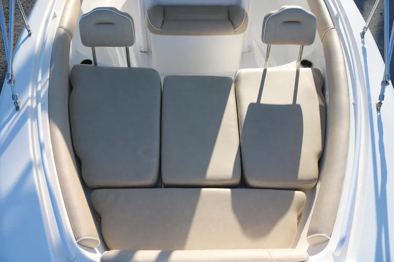 Slide: The Image of 2016 Sea Hunt Gamefish 25 boat interior with cushioned seating area. - 6