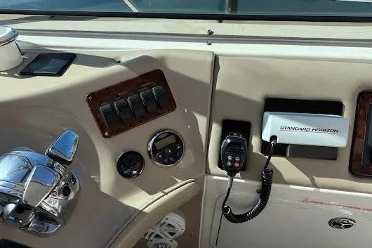 Slide: The Image of 2006 Chris Craft Corsair Heritage boat interior with elegant seating and wooden deck. - 13