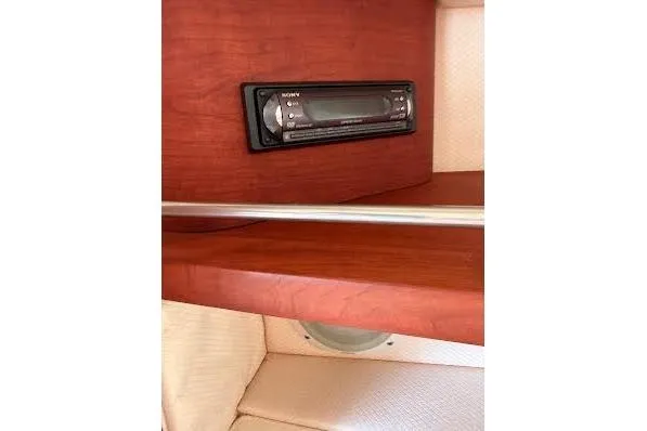 Slide: The Image of Interior of 2006 Chris-Craft Corsair 33 with wooden table and seating. - 41