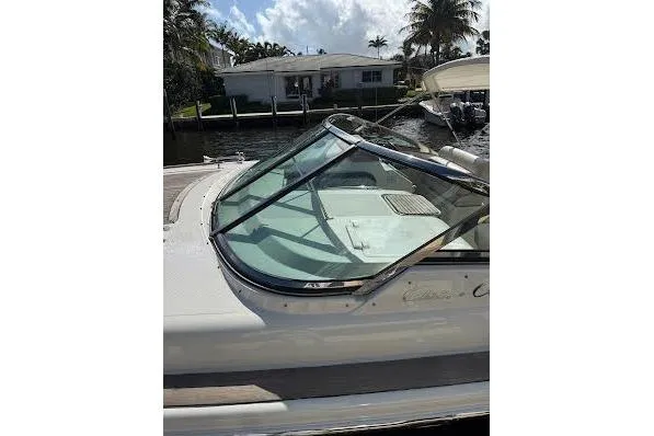 Slide: The Image of 2006 Chris Craft Corsair Heritage boat docked near waterfront home. - 9