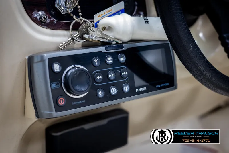 Slide: The Image of Control panel of a 2002 Chaparral 243 Sunesta boat with Fusion stereo system. - 33