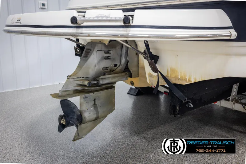 Slide: The Image of Rear view of a 2002 Chaparral 243 Sunesta boat with visible propeller and motor. - 49