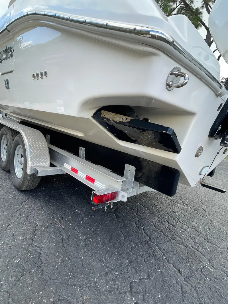 Slide: The Image of 2014 Everglades 325 Center Console boat on a trailer, rear view. - 11