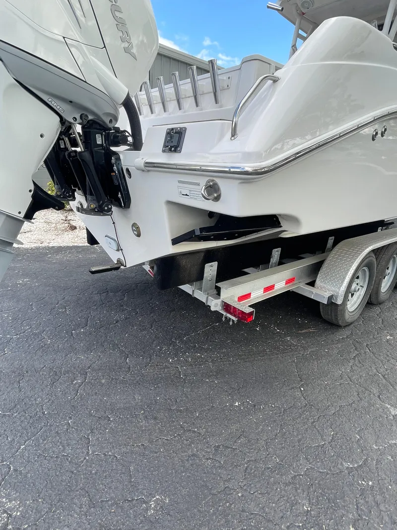 Slide: The Image of 2014 Everglades 325 Center Console boat on trailer, rear view. - 13