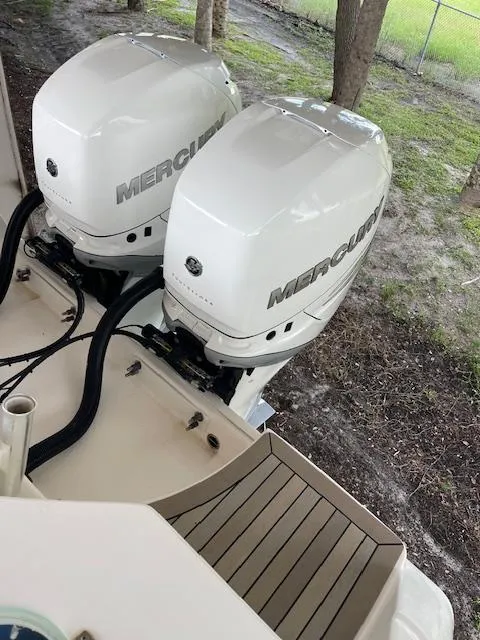 Slide: The Image of Twin Mercury outboard engines on a 2014 Everglades 325 Center Console boat. - 24