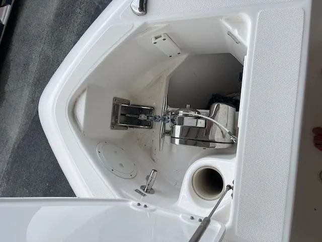 Slide: The Image of 2014 Everglades 325 Center Console anchor compartment with winch and storage. - 26