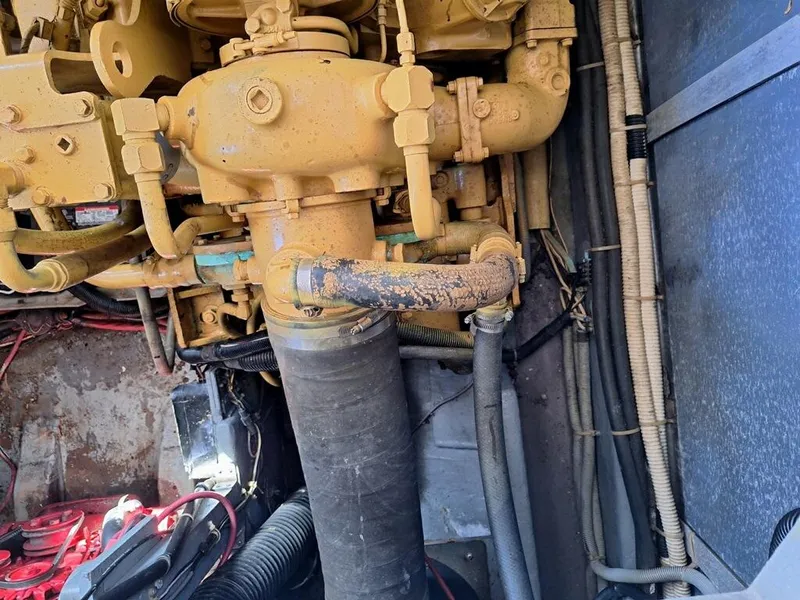 Slide: The Image of Engine compartment of a 1985 Sea Ray 390 Express Cruiser, showing mechanical components. - 17