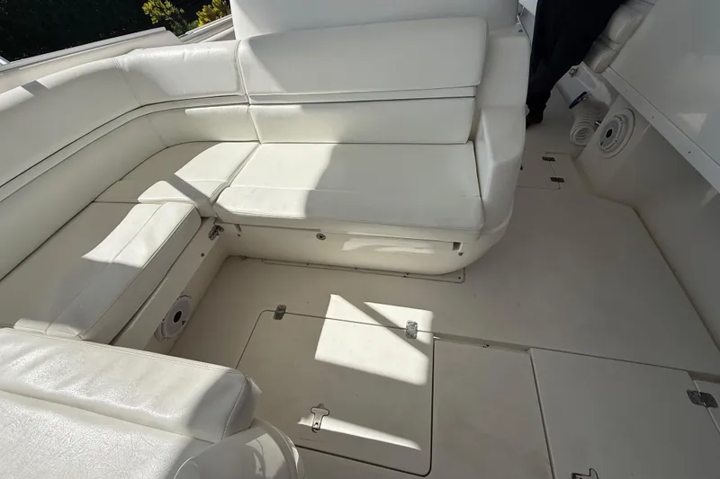 Slide: The Image of 2008 Intrepid 377 Walkaround boat interior with white cushioned seating. - 117