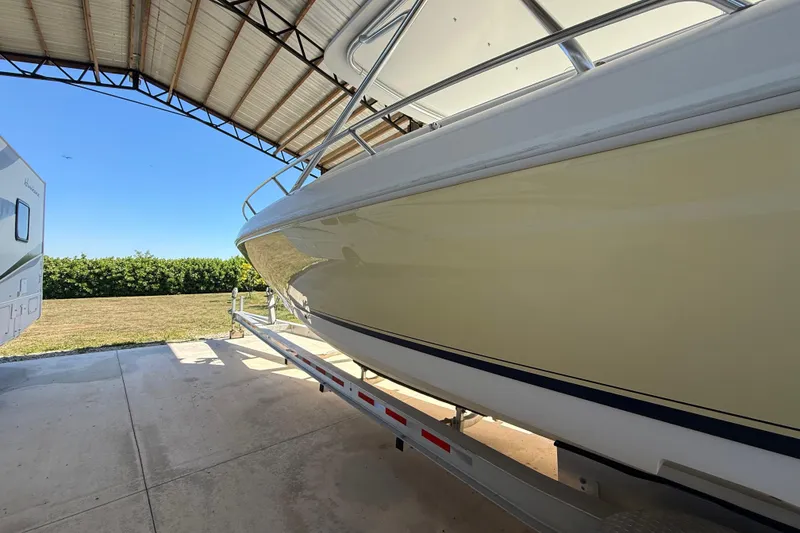 Slide: The Image of 2008 Intrepid 377 Walkaround boat on trailer under shelter, side view. - 13